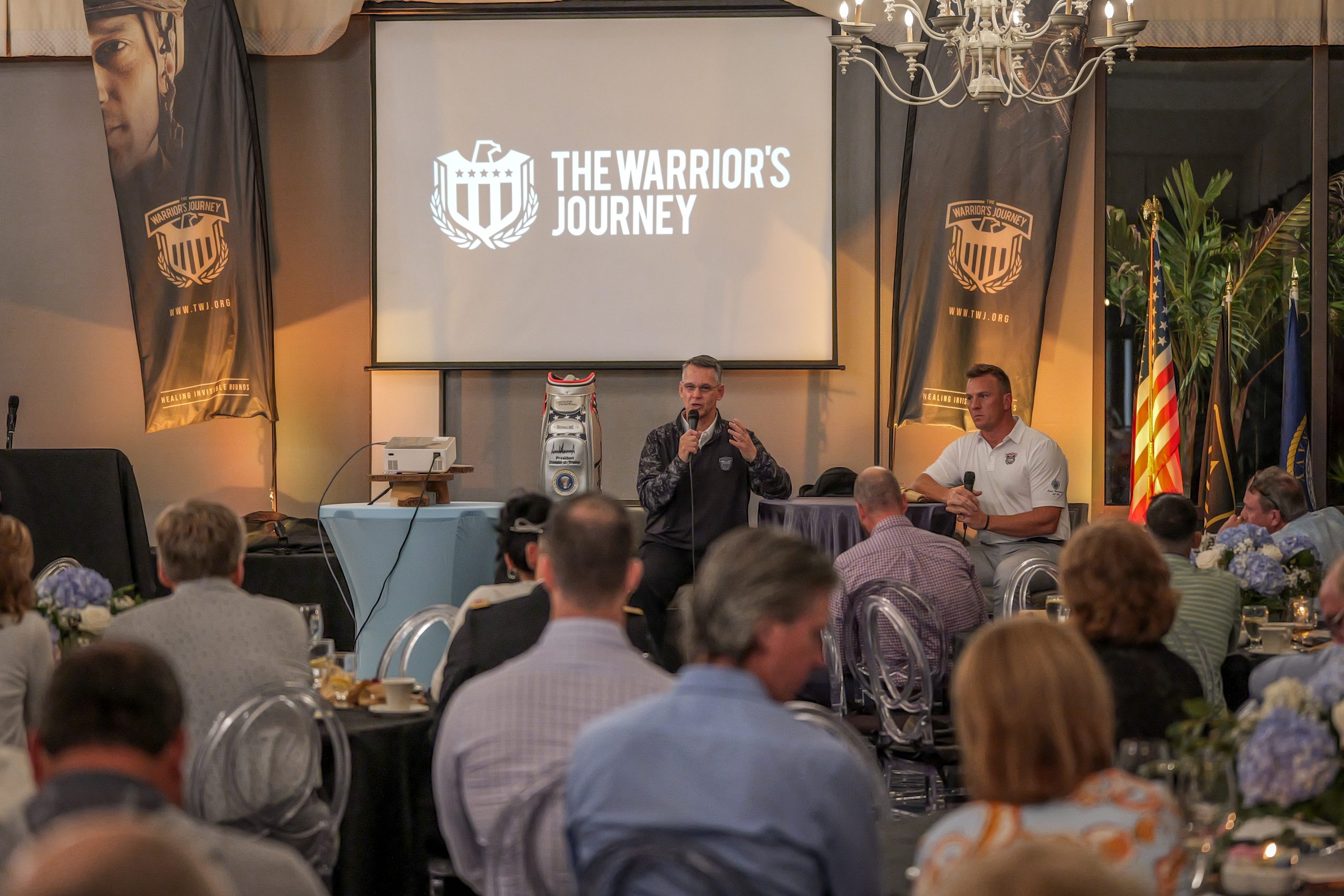 A speaker on stage during the Warrior’s Journey Classic weekend