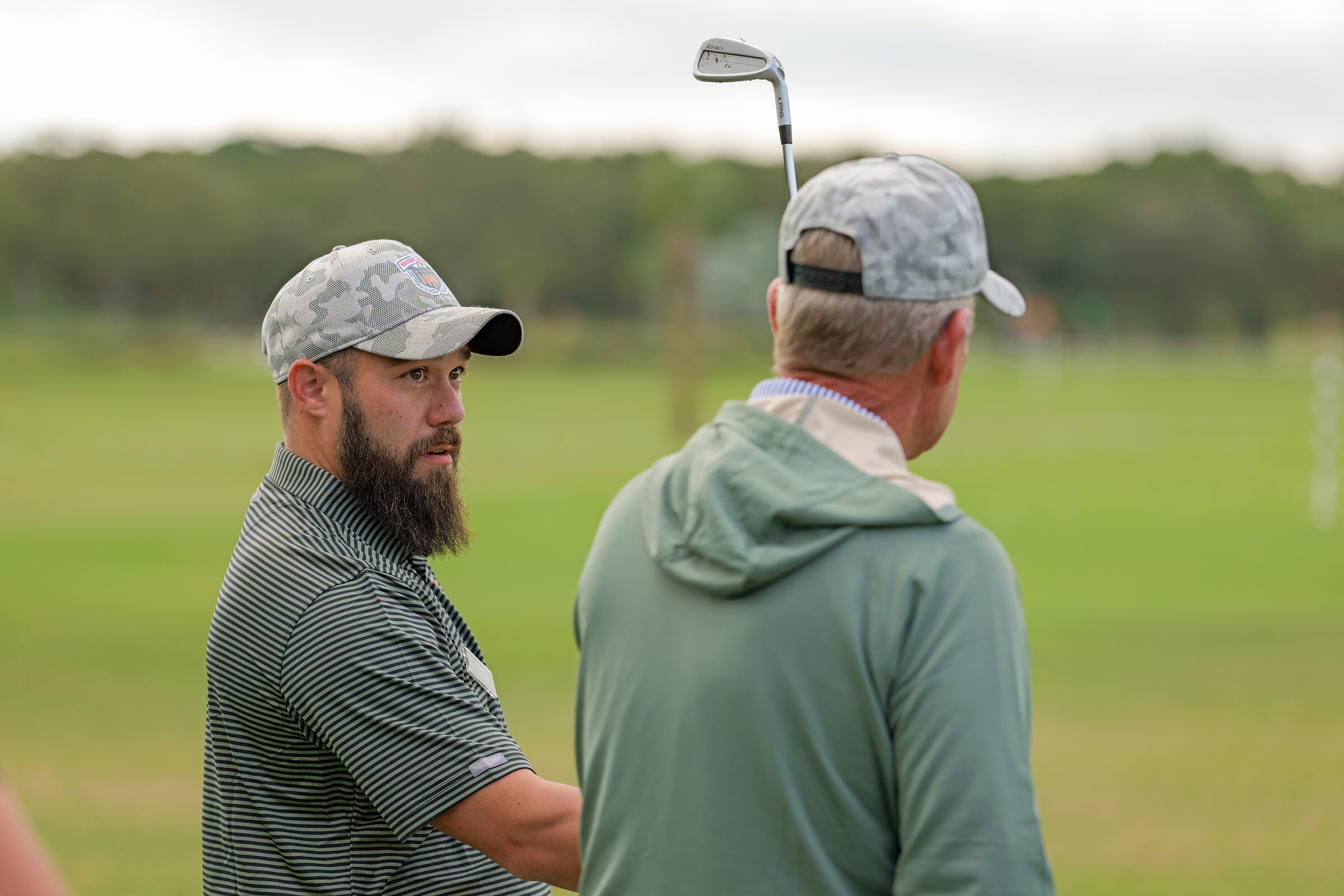 Warriors gathered in community during a golf experience